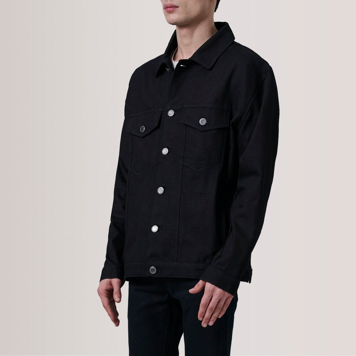 
Eddie Black Oversized Denim Trucker Jacket For Men - Lateral Side Profile View Showing Sleeve Cut & Athletic Taper Fit